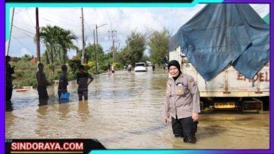 Jalan Raya Sumenep-Pamekasan Tergenang Banjir Akibat Hujan Deras, Polres Sumenep Lakukan Pengalihan Arus dan Bantu Evakuasi