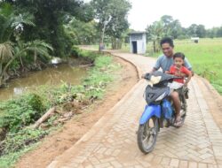 Jalan TMMD Ke-124 Buka Akses dan Kebahagiaan Baru bagi Warga Pengambau Hilir Luar