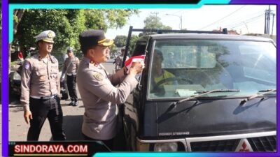 Polresta Banyuwangi Berbagi Bendera Merah Putih Sambut HUT Kemerdekaan RI ke – 80