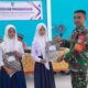 Babinsa Koramil 01/Sambas Hadiri Penyerahan Penghargaan kepada Siswa Berprestasi di Wilayah Binaan
