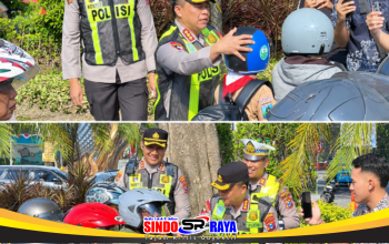 Kapolrestabes Surabaya Kombes Pol. Luthfie Sulistiawan memberikan helm kepada pengendara tertib.